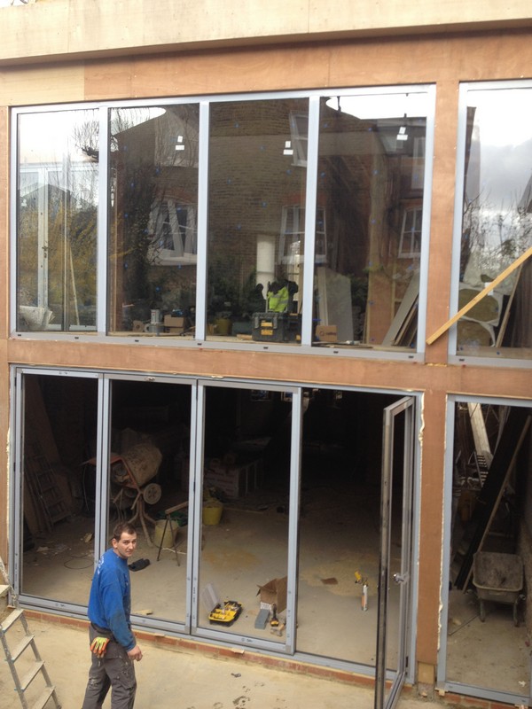 Aluminium bi-fold doors with two-storey glazing in Luton