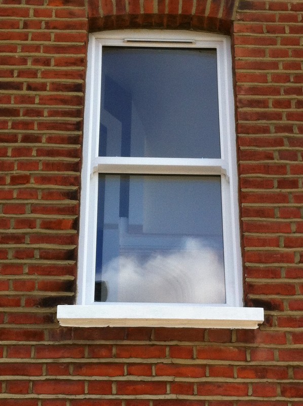 uPVC sash window on Victorian red brick house in Luton